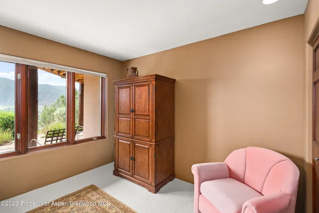 a livingroom with a large window