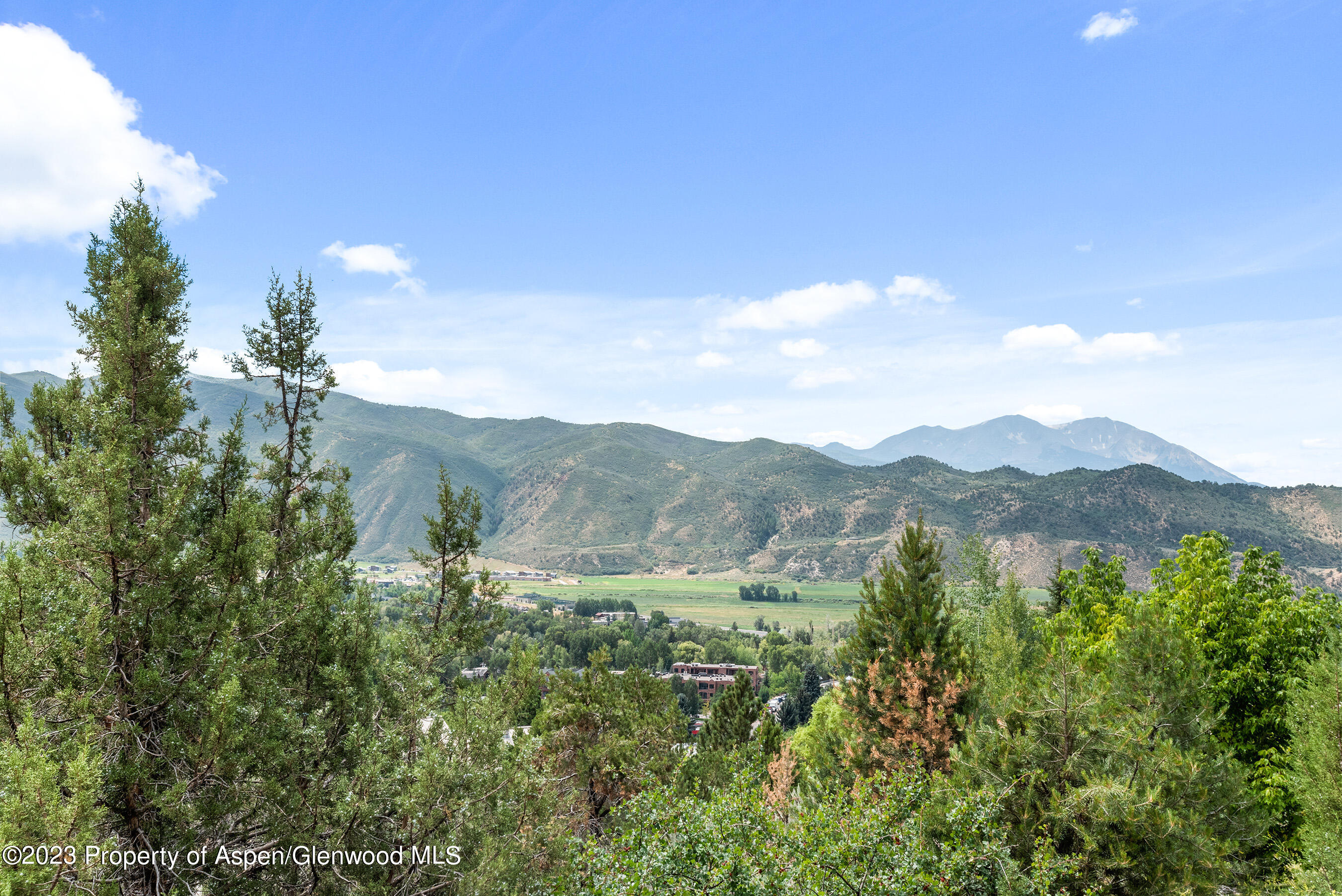 132 Ridge Road Basalt, CO 81621 - Photo 2 of 22 a view of a house with a mountain in the background