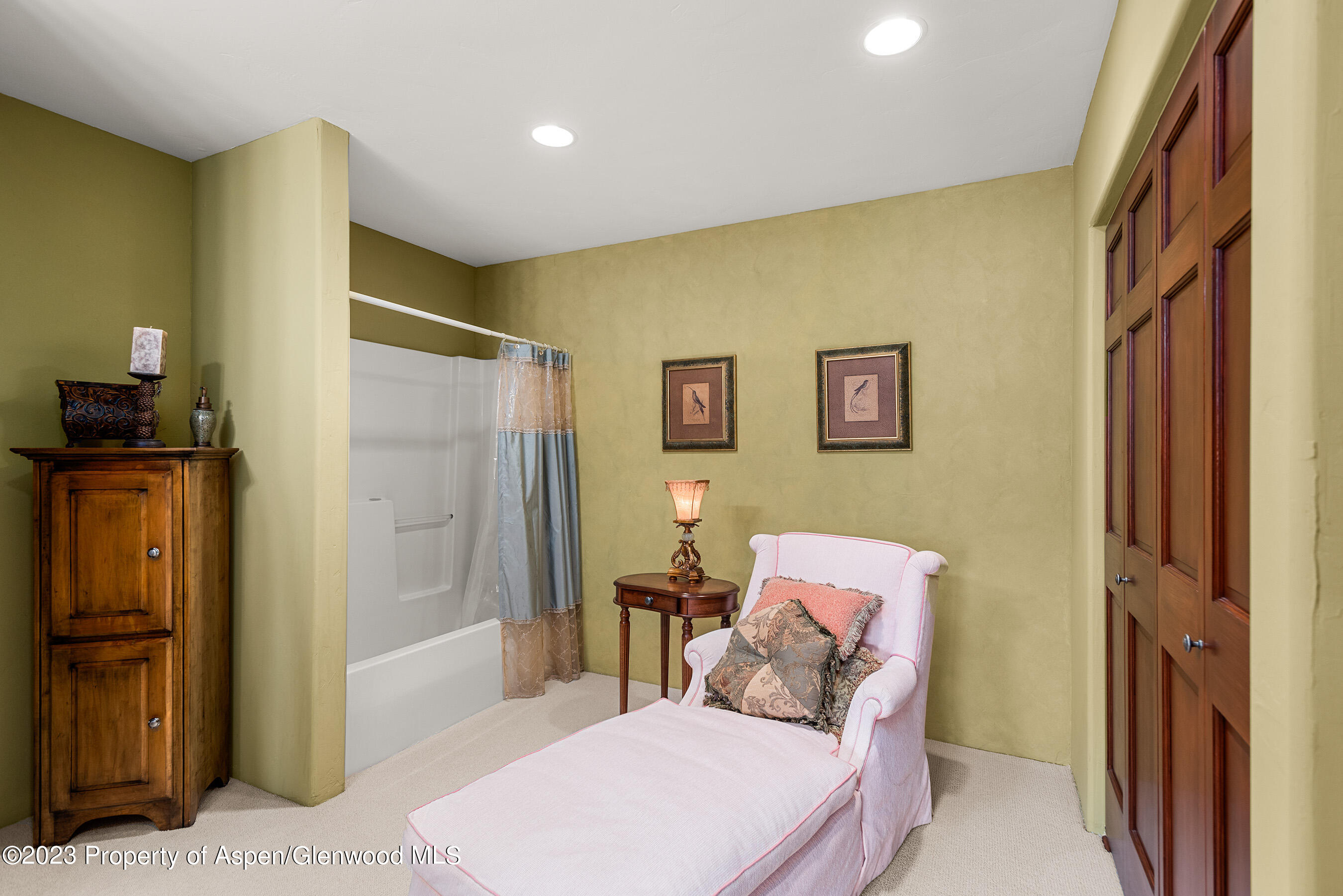 132 Ridge Road Basalt, CO 81621 - Photo 21 of 22 a bedroom with a bed and wooden floor