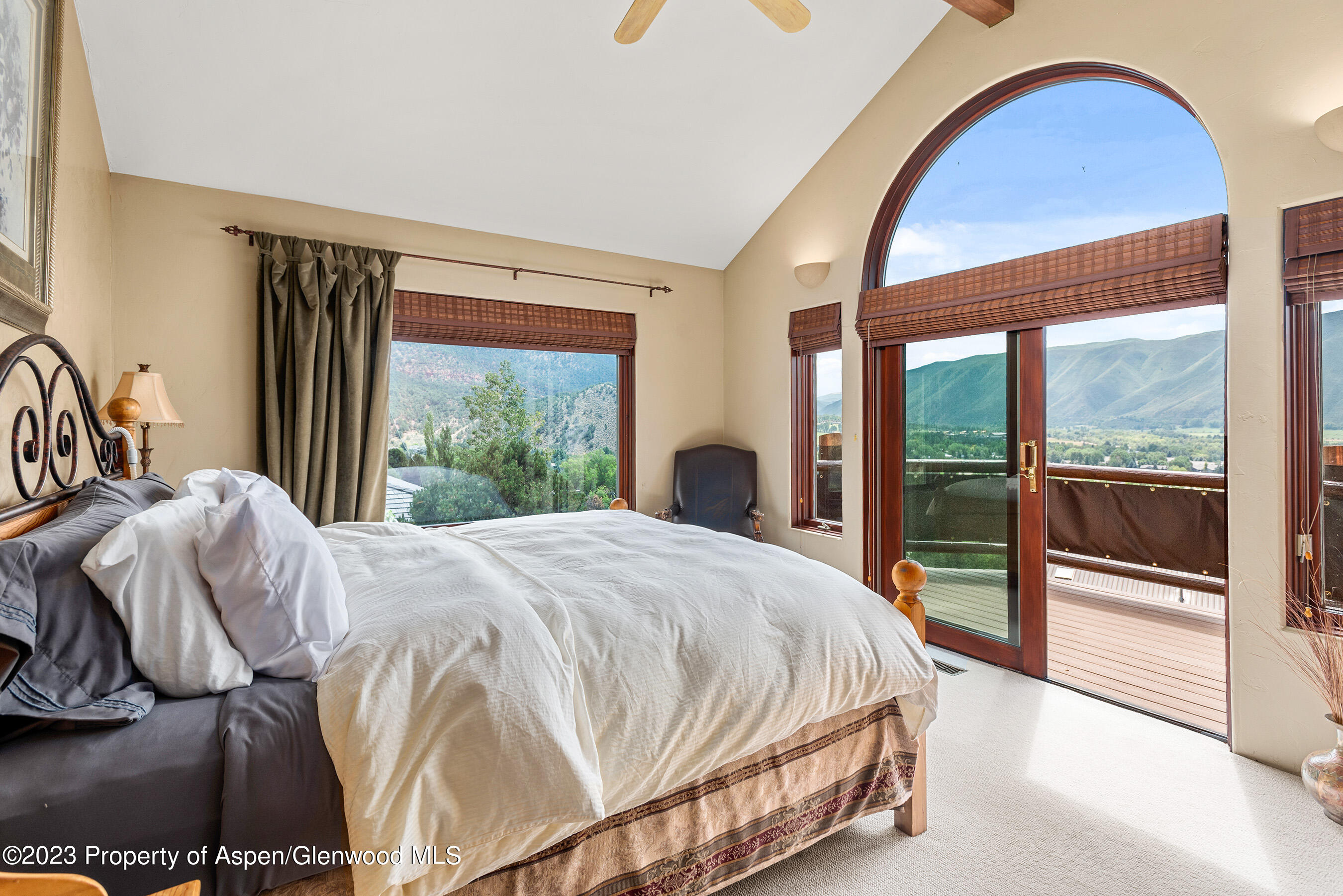 132 Ridge Road Basalt, CO 81621 - Photo 8 of 22 a bed sitting in a bedroom next to a window