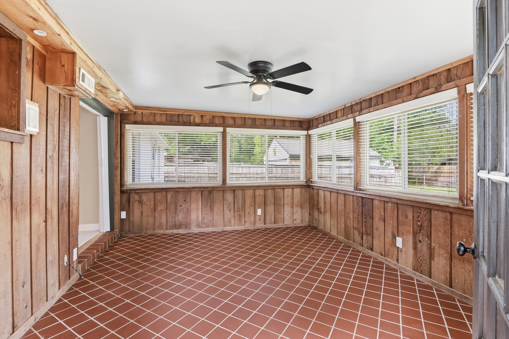 312 Fernway Road Memphis, TN 38117 - Photo 22 of 38 Unfurnished sunroom with wood walls and plenty of natural light