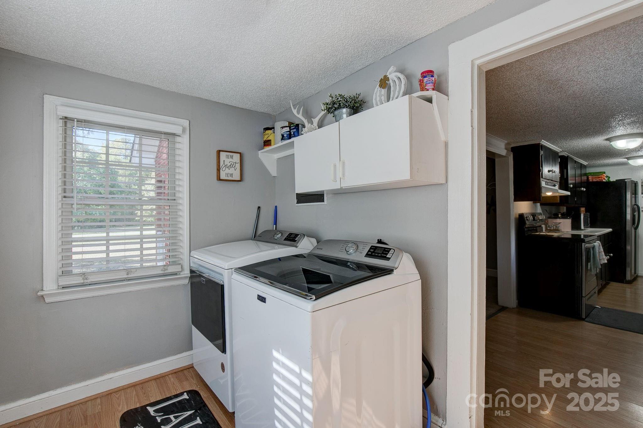 951 Evans Mill Road Pageland, SC 29728 - Photo 13 of 28 a kitchen that has a sink a stove and a refrigerator