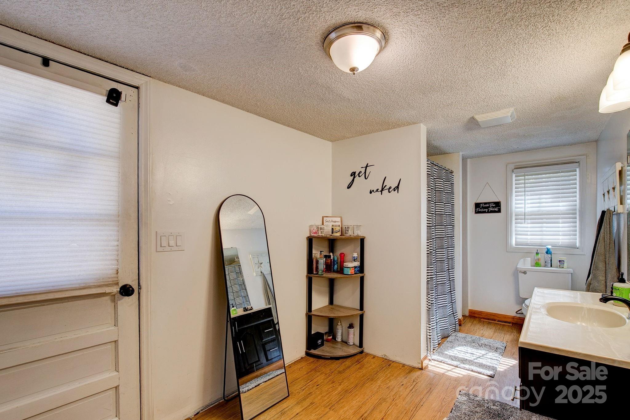 951 Evans Mill Road Pageland, SC 29728 - Photo 21 of 28 a view of a bedroom with workspace and bedroom