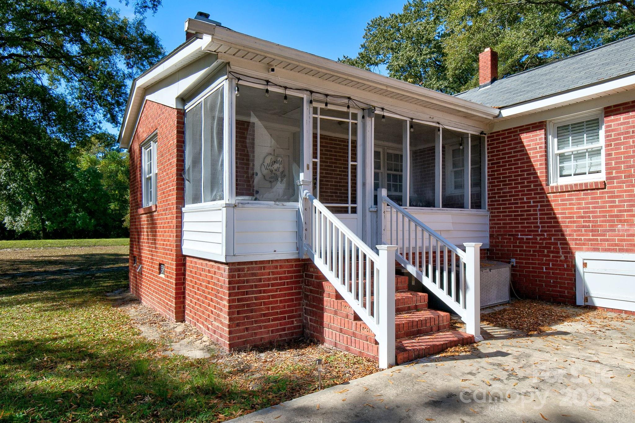 951 Evans Mill Road Pageland, SC 29728 - Photo 26 of 28 a view of a house with backyard and porch