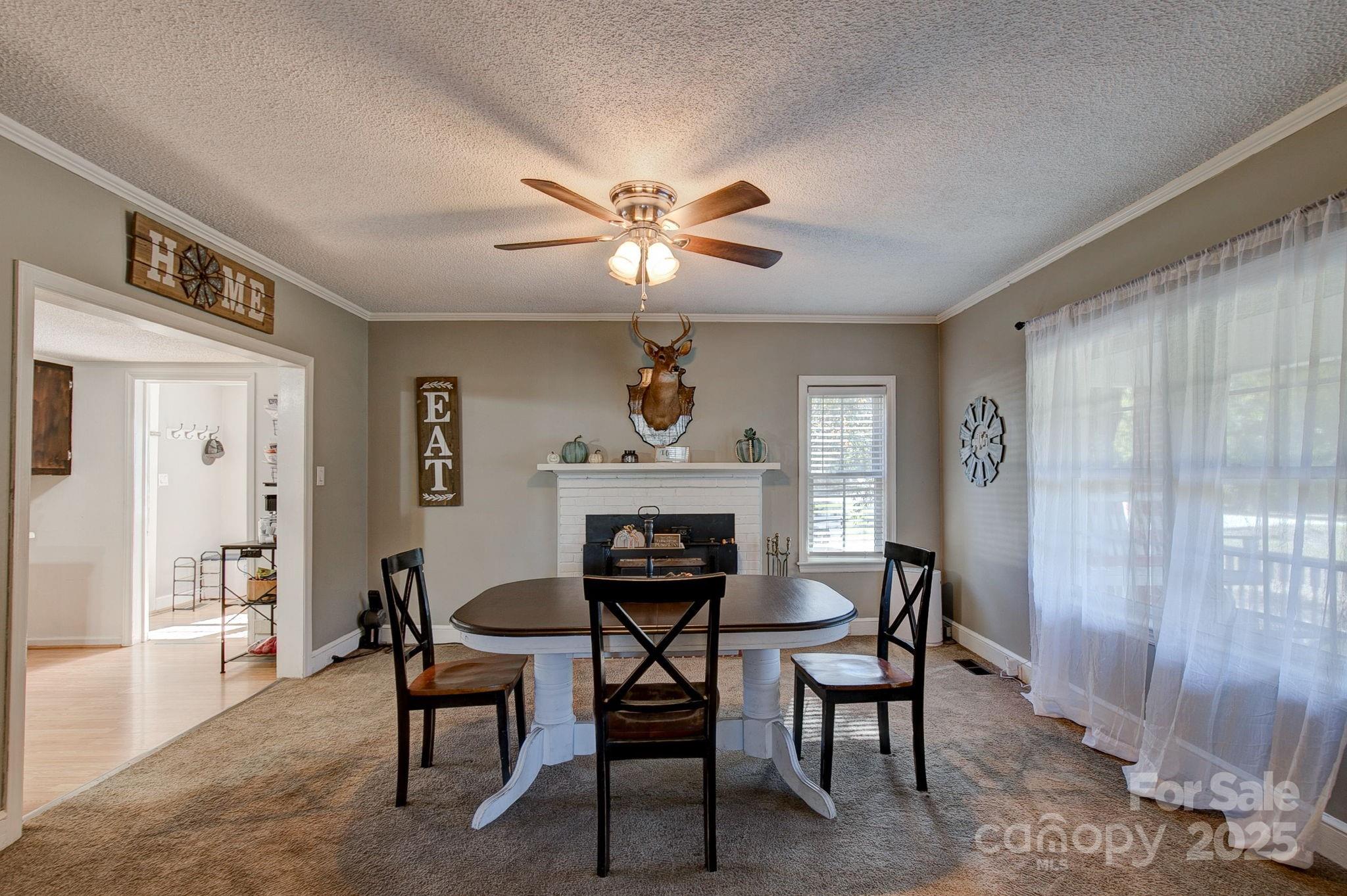951 Evans Mill Road Pageland, SC 29728 - Photo 7 of 28 a view of a livingroom with furniture and a chandelier fan