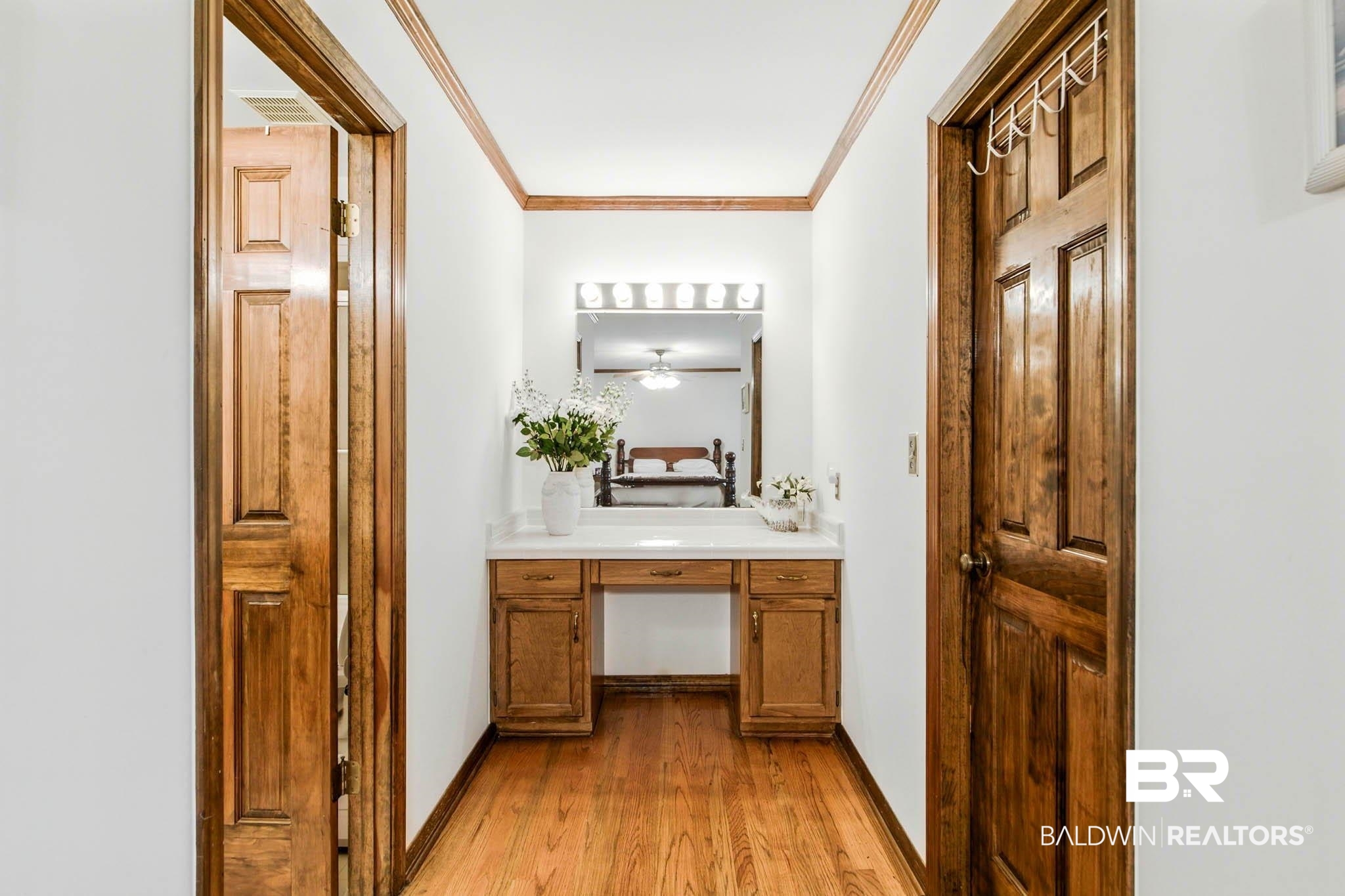 17270 Davis Road Summerdale, AL 36580 - Photo 25 of 97 Bathroom featuring ornamental molding, vanity, and light wood-style flooring