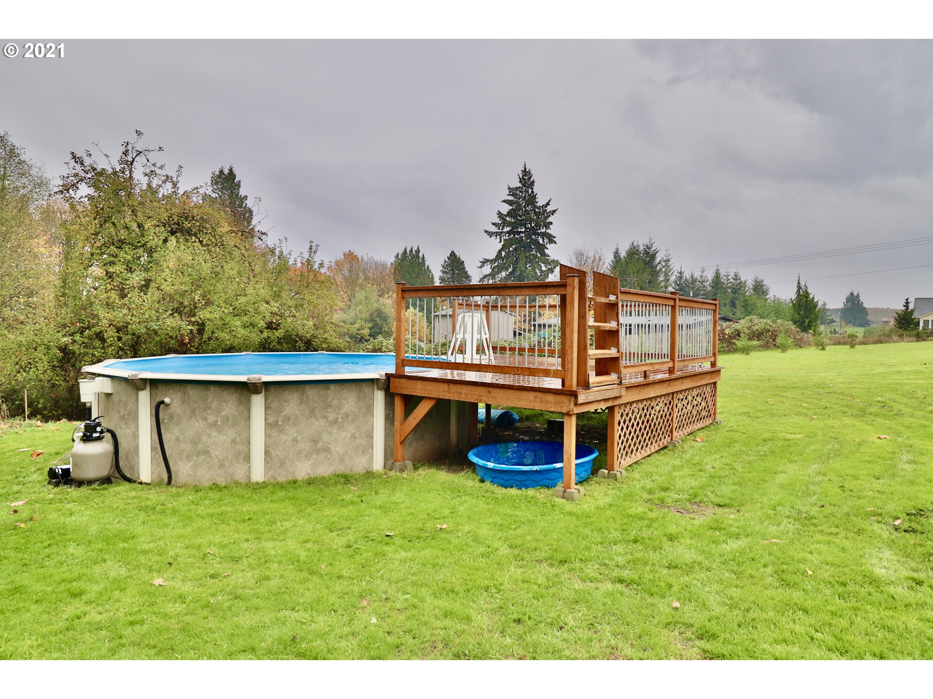 204 Wohl Road Longview, WA 98632 - Photo 24 of 31 a view of a house with a yard and sitting area