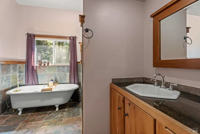 a room with a sink and a mirror