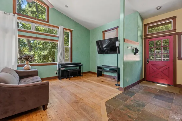 a living room with furniture and a flat screen tv
