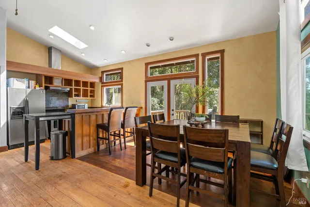 a view of a dining room with furniture and a window