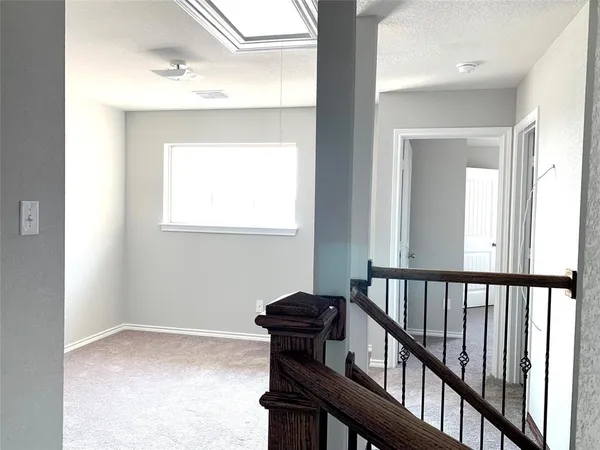 a view of a hallway with windows