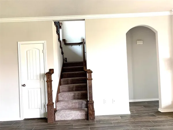 a view of entryway with wooden floor