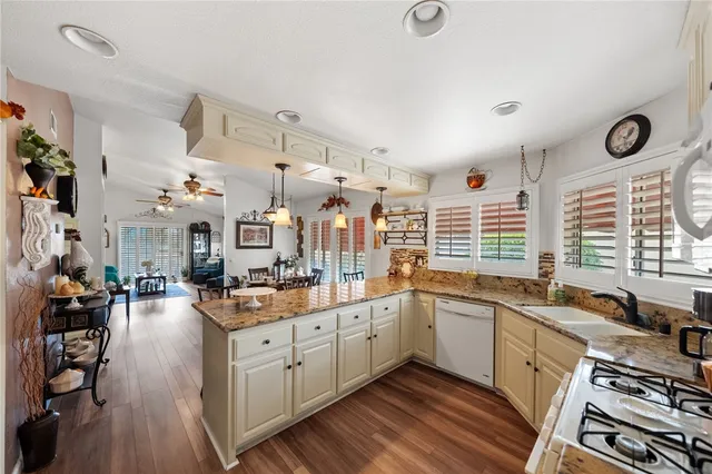 a kitchen with refrigerator and cabinets