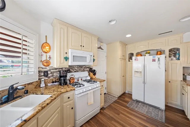 a living room with furniture fireplace and flat screen tv