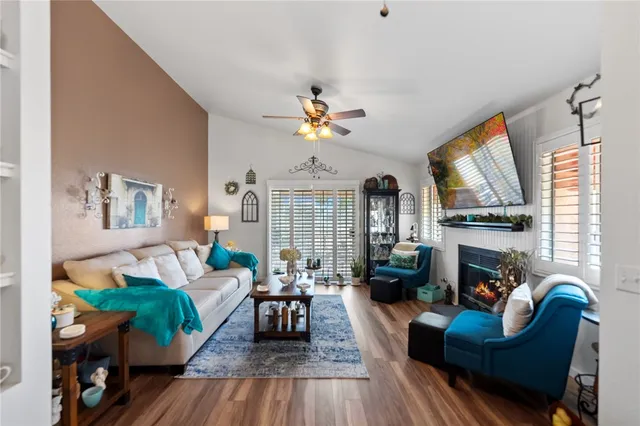 a living room with furniture fireplace and a fireplace