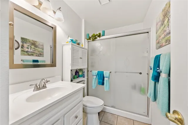 a view of a hallway with workspace and a window