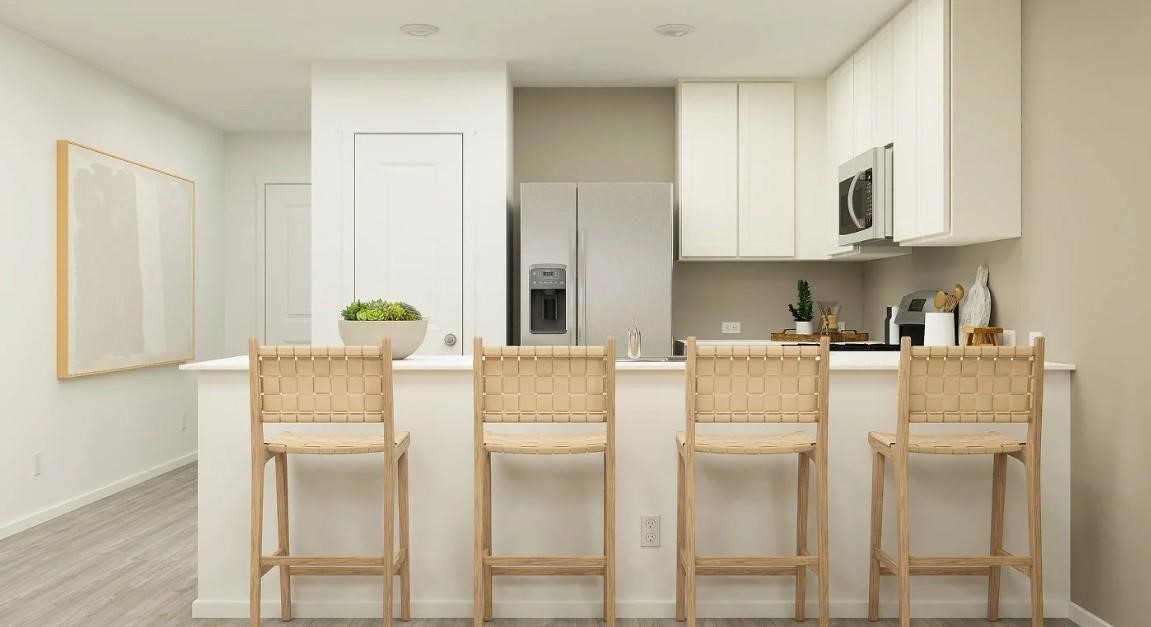 3008 Colusa Rdg Drive Katy, TX 77493 - Photo 11 of 14 a white kitchen with stainless steel appliances granite countertop a refrigerator and a stove top oven