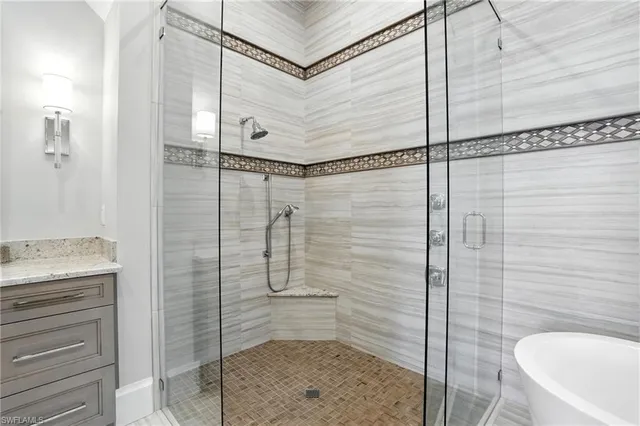 a bathroom with a shower and a sink