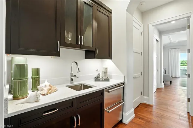 a kitchen with a sink and cabinets