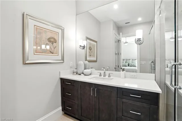 a bathroom with a double vanity sink mirror and double