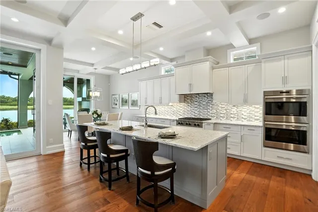 a kitchen with a sink stove and cabinets
