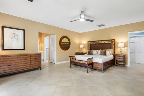 a view of a patio with couches chairs and a potted plant