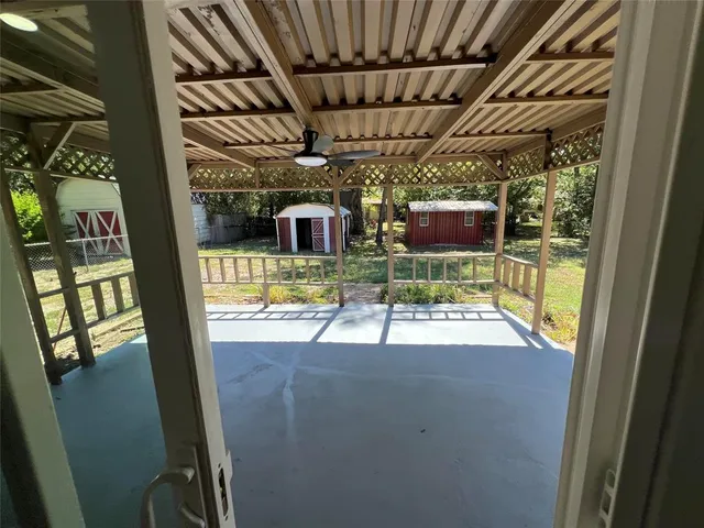 a view of a chairs and table in the patio