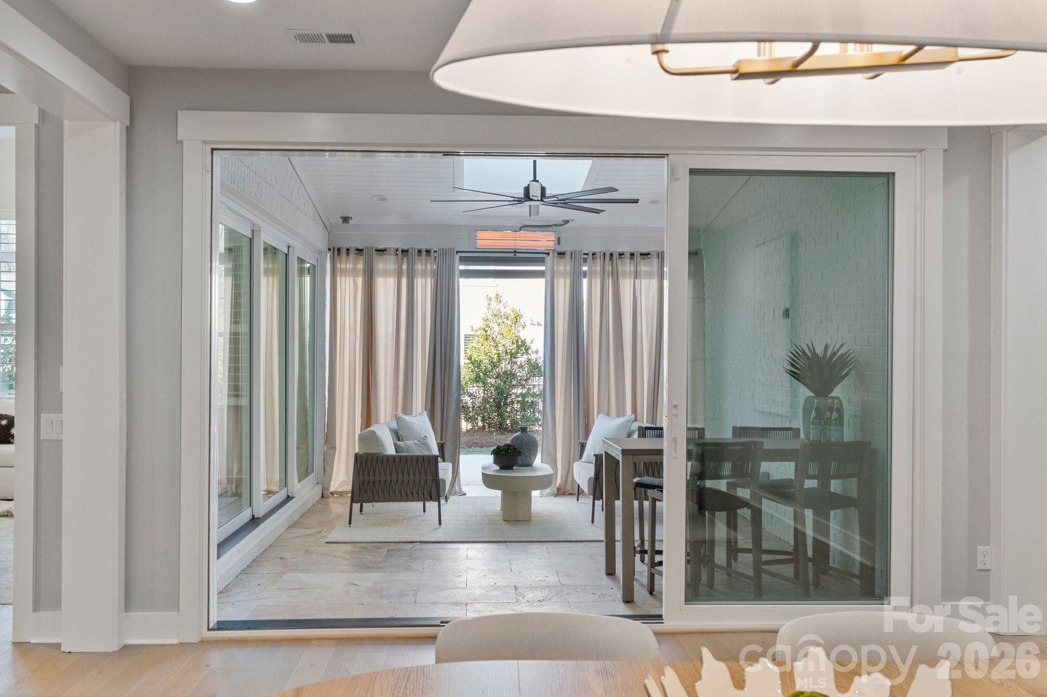 4031 Pritchard Place Fort Mill, SC 29715 - Photo 16 of 48 a view of a livingroom with a floor to ceiling window and wooden floor