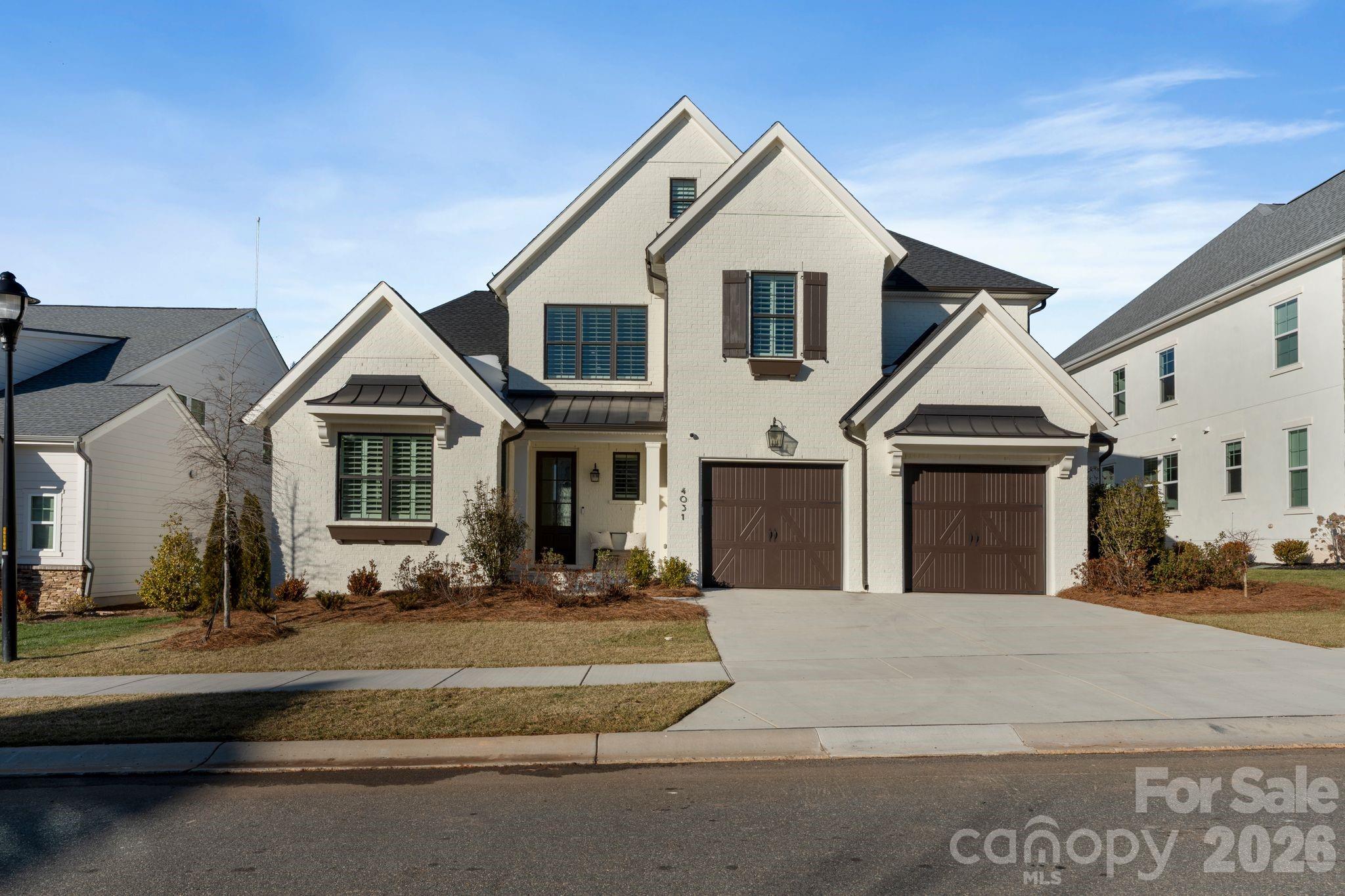 4031 Pritchard Place Fort Mill, SC 29715 - Photo 2 of 48 a front view of a house with a yard