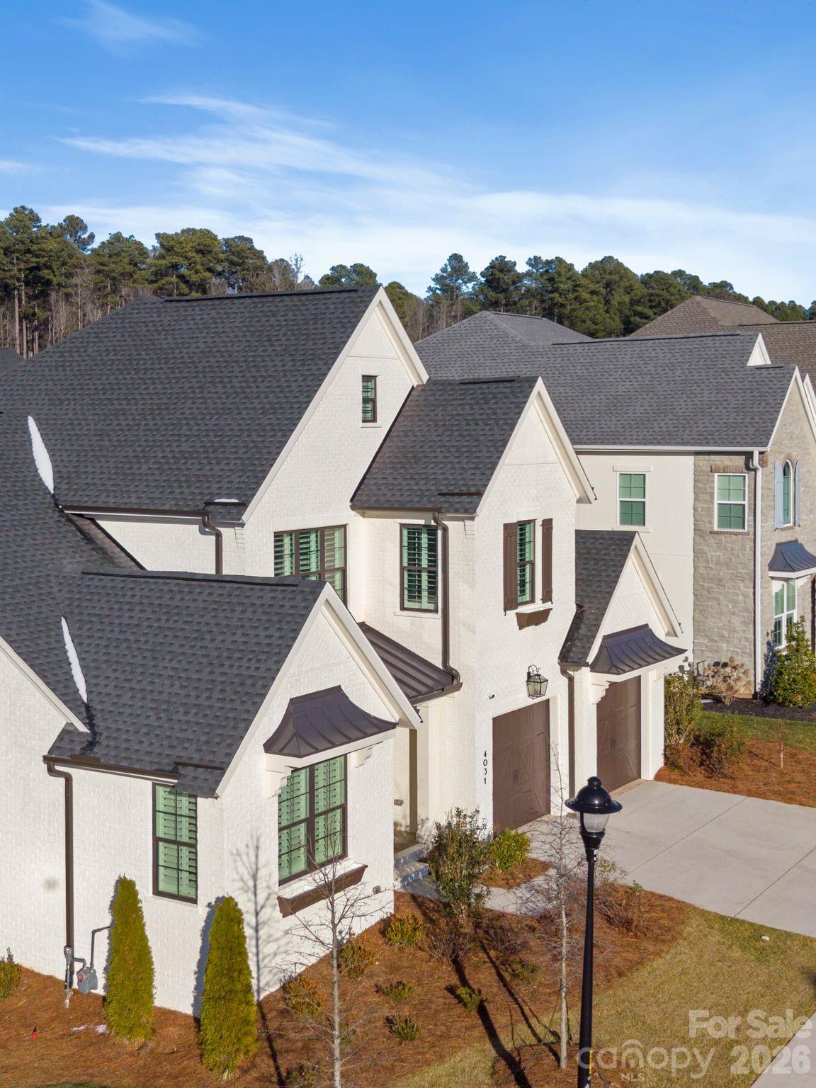4031 Pritchard Place Fort Mill, SC 29715 - Photo 2 of 48 a front view of a house with a yard