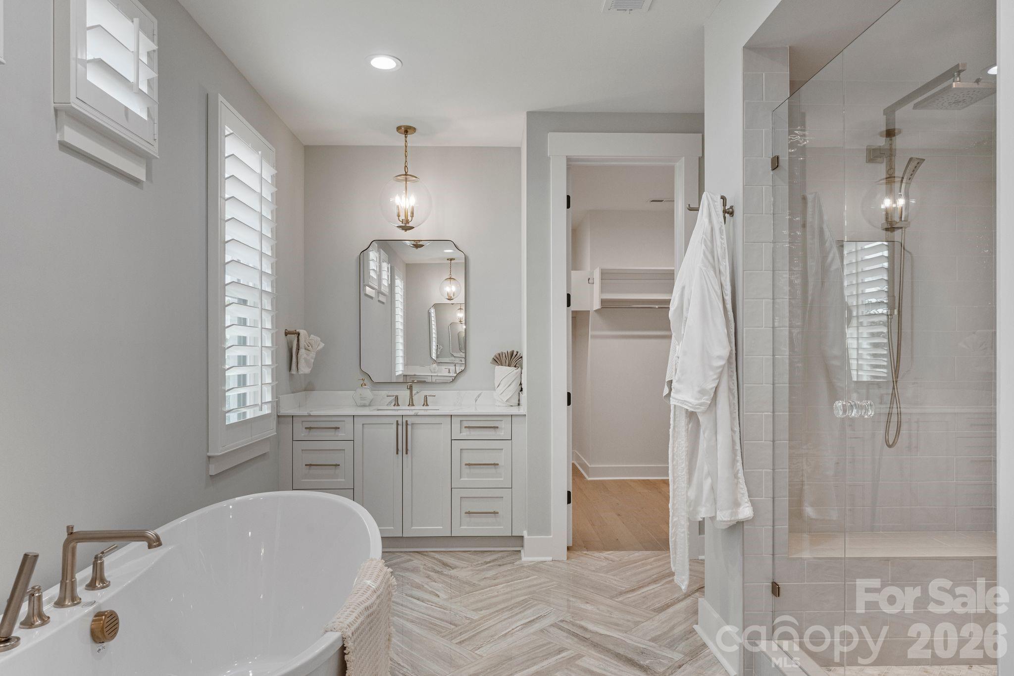 4031 Pritchard Place Fort Mill, SC 29715 - Photo 25 of 48 a bathroom with a sink a toilet and shower