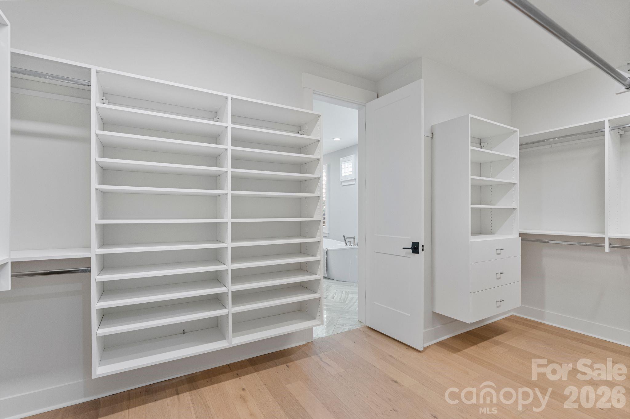 4031 Pritchard Place Fort Mill, SC 29715 - Photo 26 of 48 a view of room with walk in closet and empty shelves