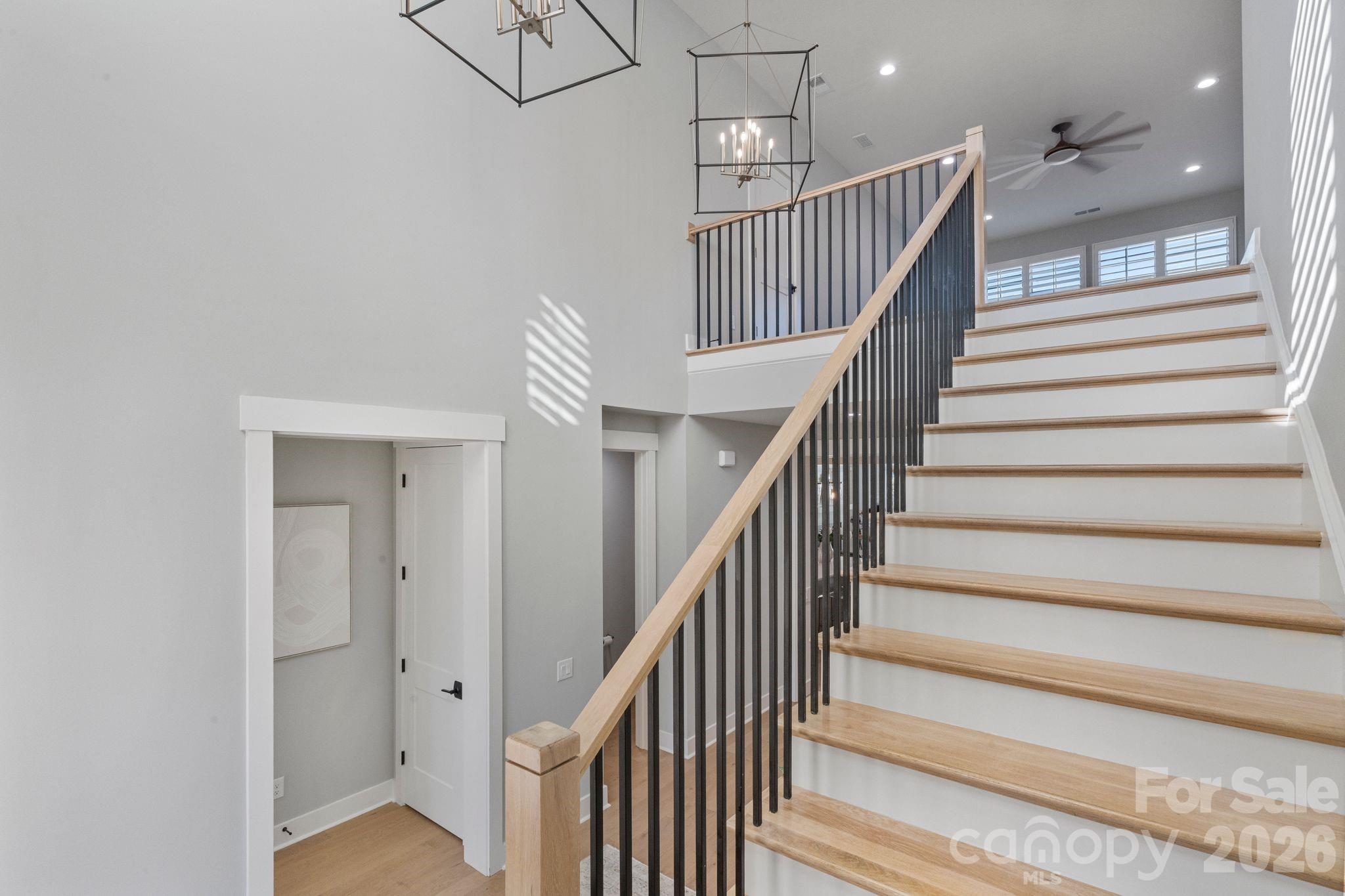 4031 Pritchard Place Fort Mill, SC 29715 - Photo 35 of 48 a view of staircase with railing and white walls