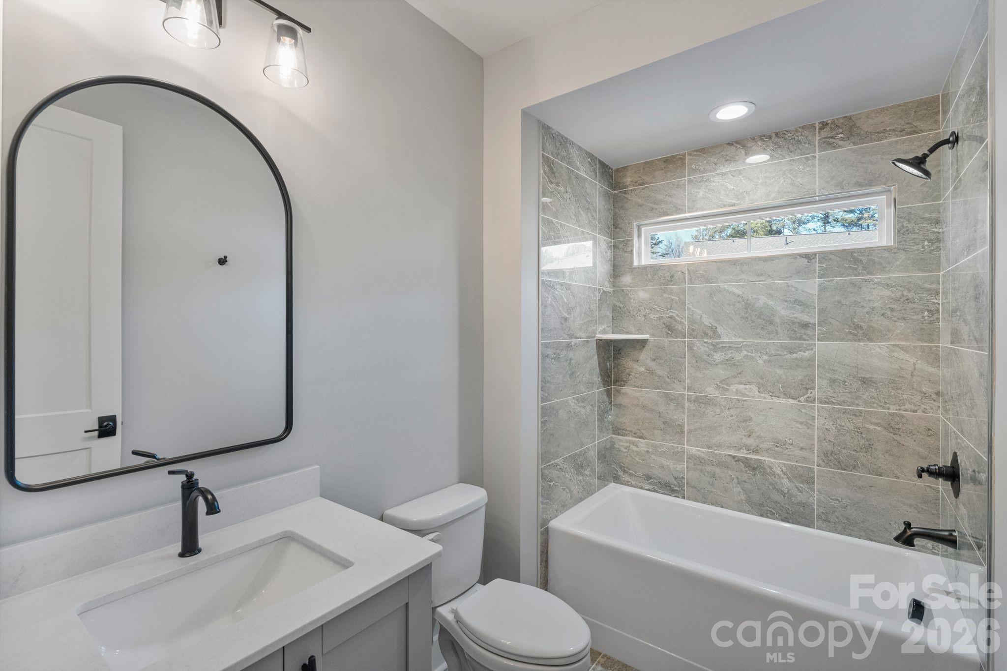 4031 Pritchard Place Fort Mill, SC 29715 - Photo 37 of 48 a bathroom with a toilet a sink and bathtub