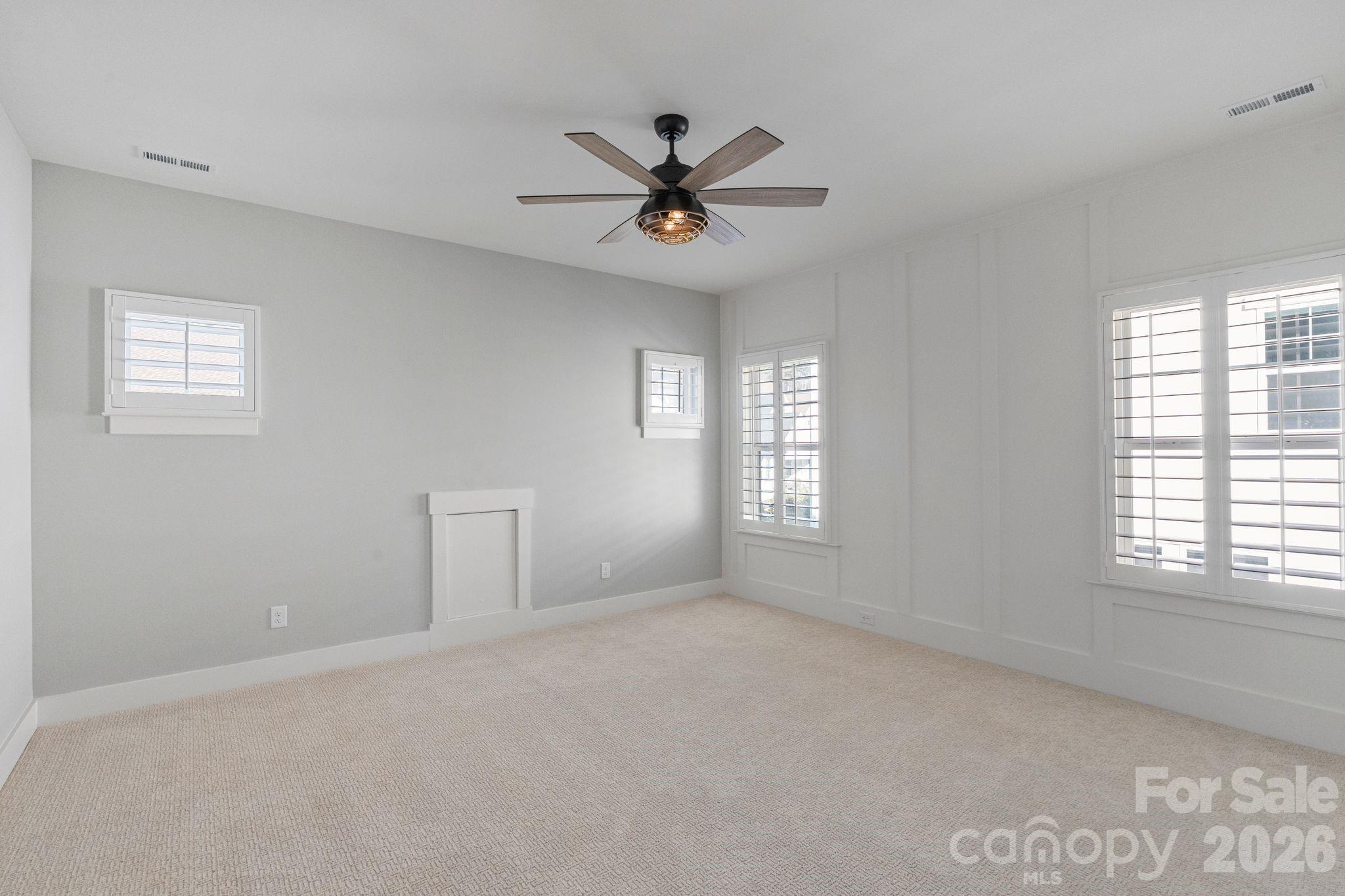 4031 Pritchard Place Fort Mill, SC 29715 - Photo 37 of 48 a view of a livingroom with a ceiling fan and window