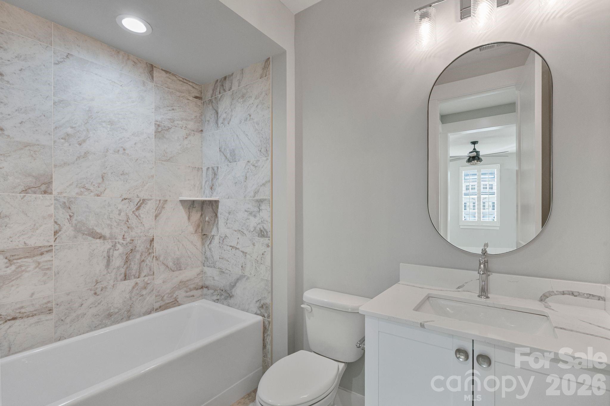 4031 Pritchard Place Fort Mill, SC 29715 - Photo 43 of 48 a bathroom with a toilet sink and bathtub