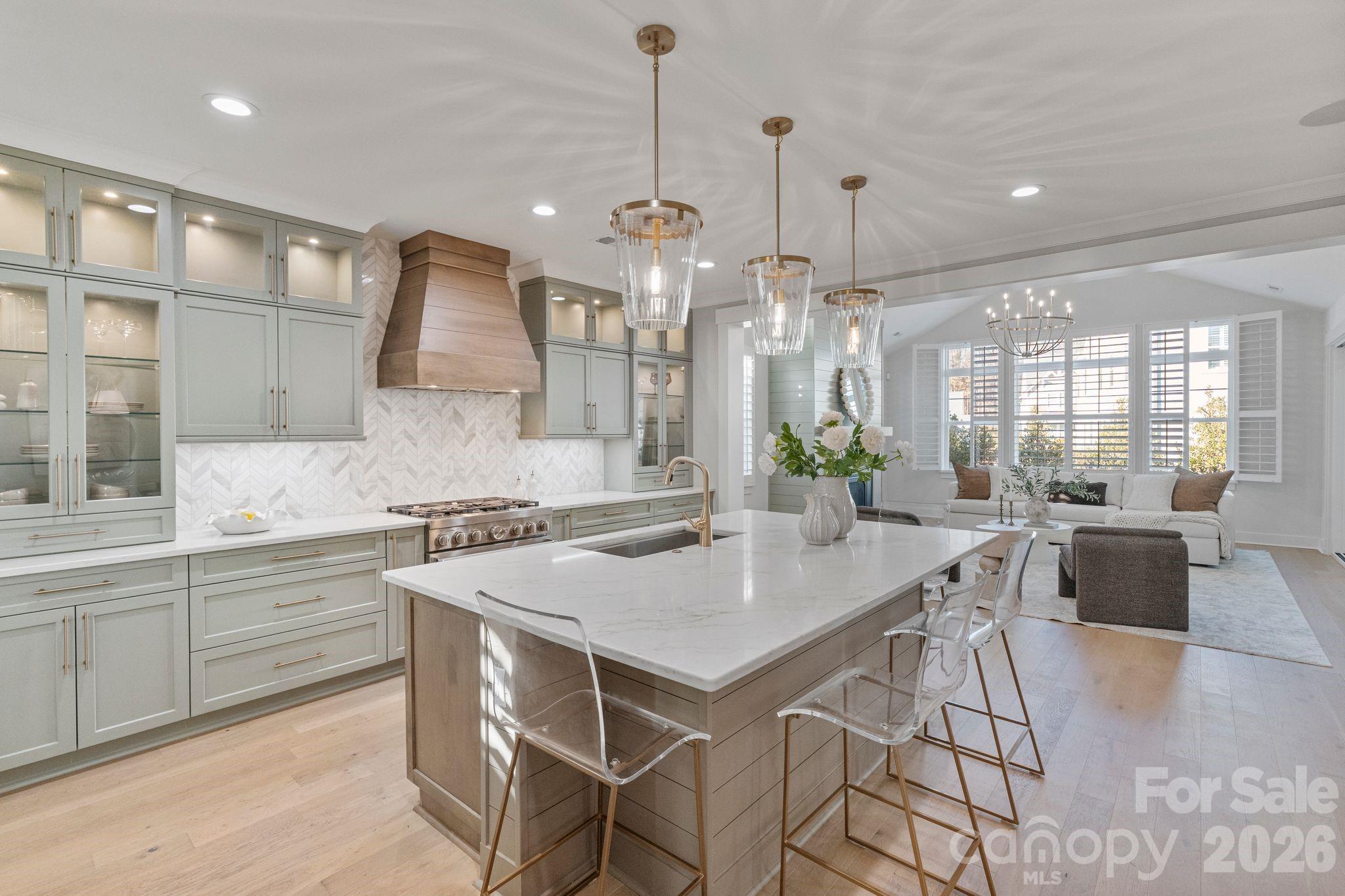 4031 Pritchard Place Fort Mill, SC 29715 - Photo 7 of 48 a kitchen with a table chairs sink and cabinets
