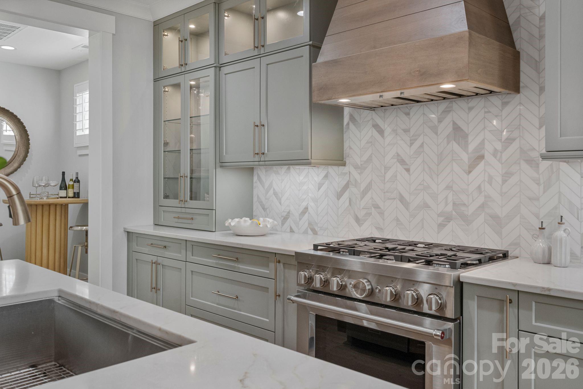4031 Pritchard Place Fort Mill, SC 29715 - Photo 9 of 48 a kitchen with granite countertop a stove and a sink