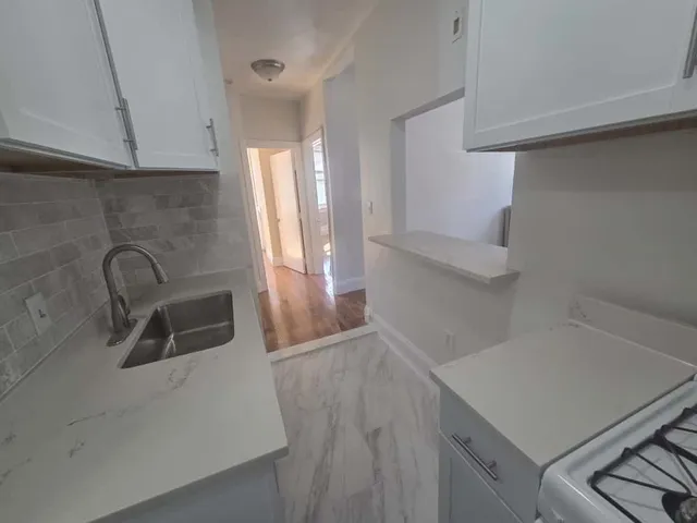 a view of storage and utility room with a sink