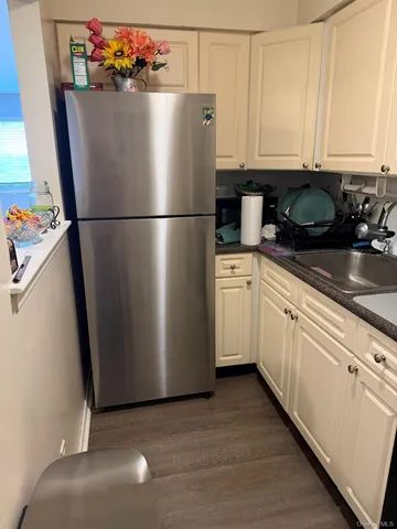 a white refrigerator freezer sitting inside of a kitchen