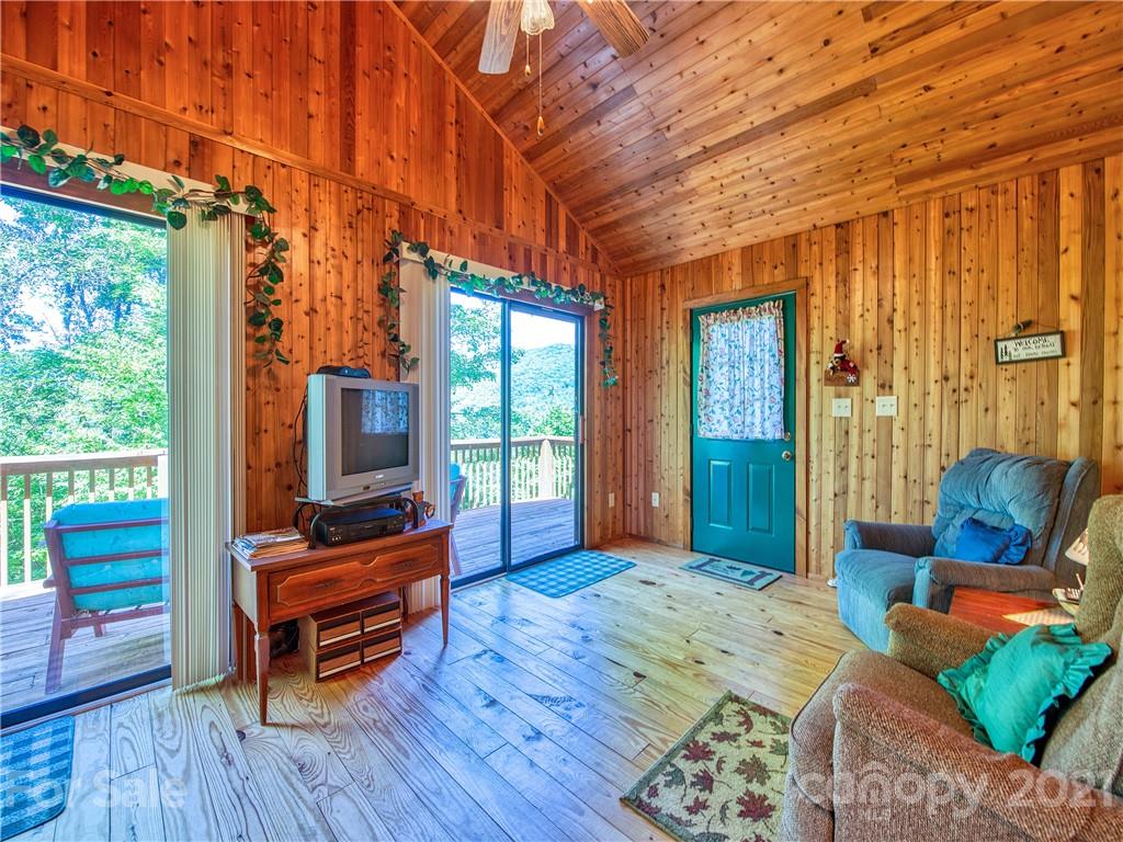 195 Mopey Maple Road Waynesville, NC 28785 - Photo 15 of 23 a bedroom with furniture and a flat screen tv