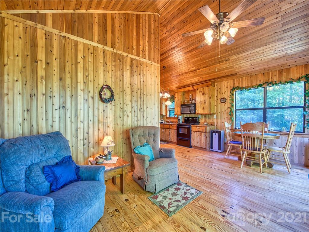 195 Mopey Maple Road Waynesville, NC 28785 - Photo 16 of 23 a living room with furniture and a large window