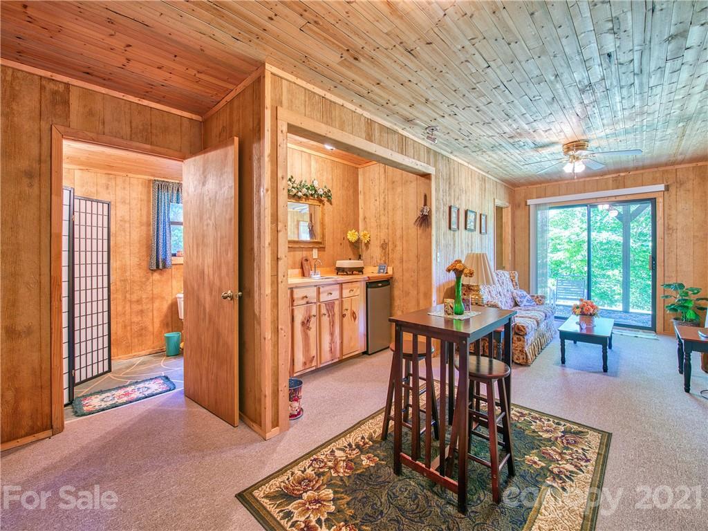195 Mopey Maple Road Waynesville, NC 28785 - Photo 20 of 23 a view of a dining room with furniture window and outside view