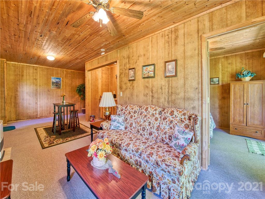 195 Mopey Maple Road Waynesville, NC 28785 - Photo 21 of 23 a living room with couch