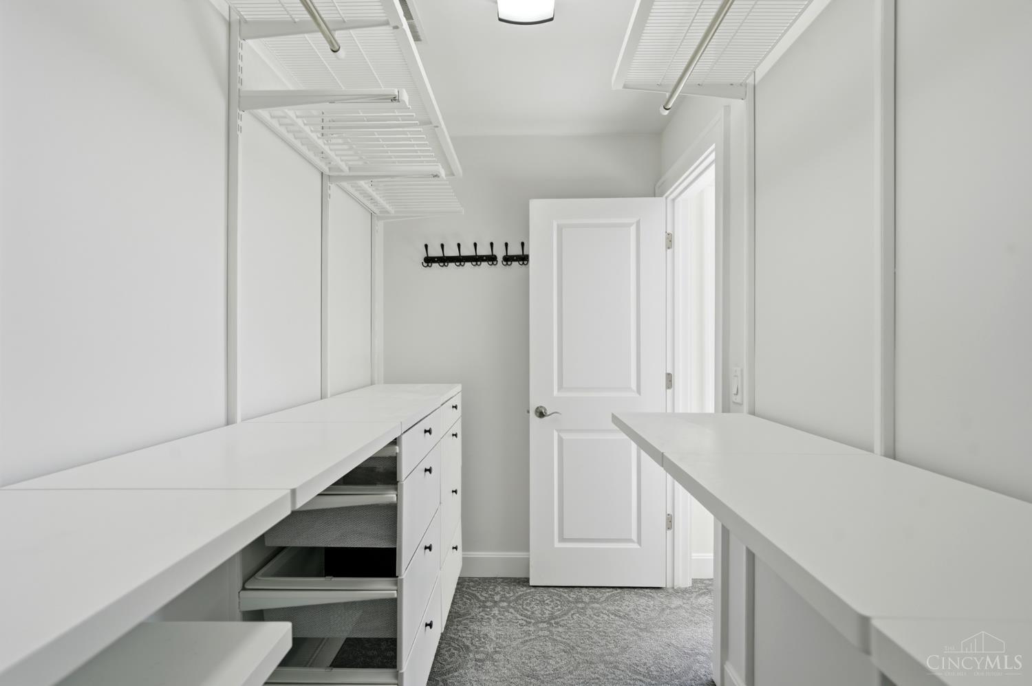 3003 Riverside Drive Cincinnati, OH 45226 - Photo 23 of 65 Primary closet space with custom cabinetry/closet organization.