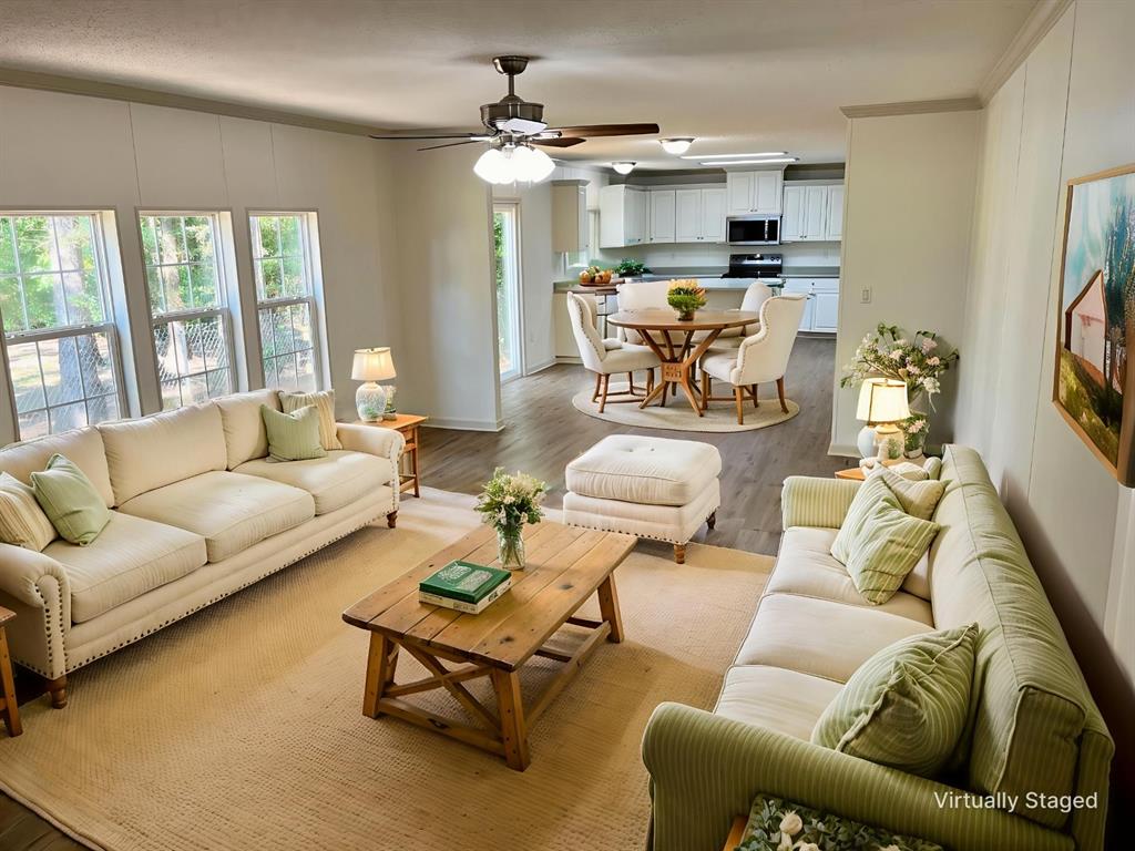 6913 Rice Road Shreveport, LA 71129 - Photo 8 of 26 a living room with furniture and a flat screen tv