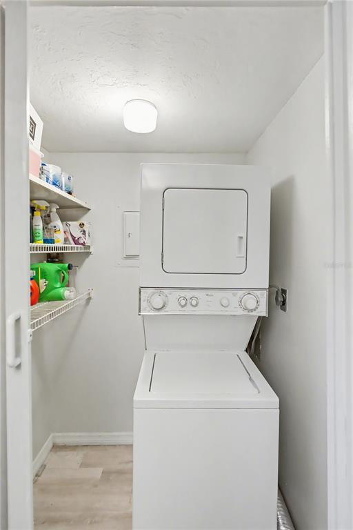6157 Midnight Pass Road, Unit E23 Sarasota, FL 34242 - Photo 19 of 49 a utility room with dryer and washer