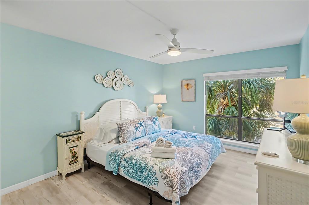 6157 Midnight Pass Road, Unit E23 Sarasota, FL 34242 - Photo 20 of 49 a bedroom with a bed and a window