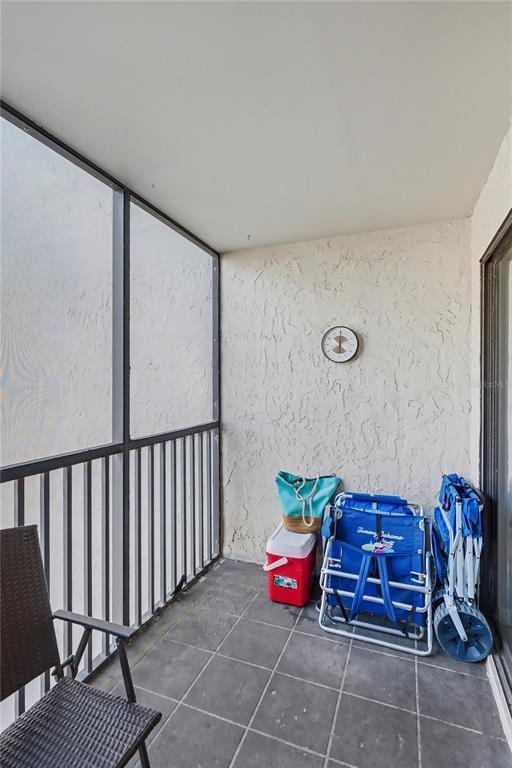 6157 Midnight Pass Road, Unit E23 Sarasota, FL 34242 - Photo 27 of 49 a bedroom with furniture and a potted plant