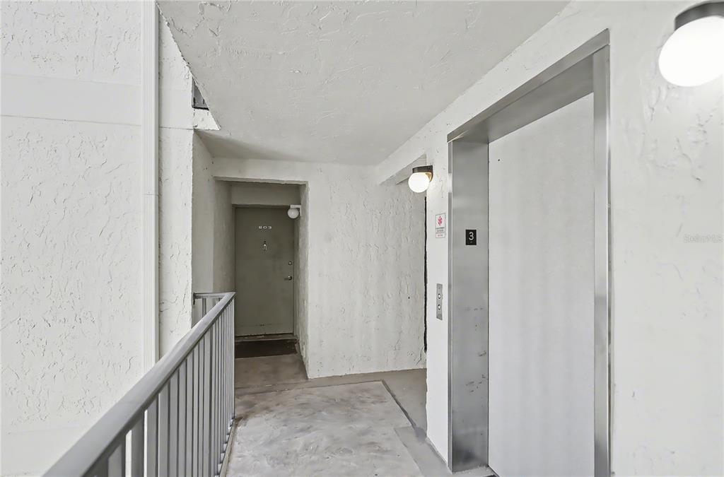 6157 Midnight Pass Road, Unit E23 Sarasota, FL 34242 - Photo 29 of 49 a view of a hallway